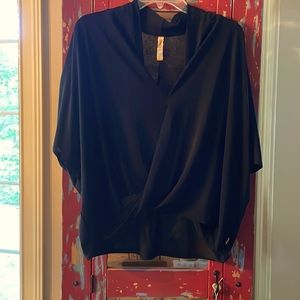 Fun light ladies black wrap top. Size Large